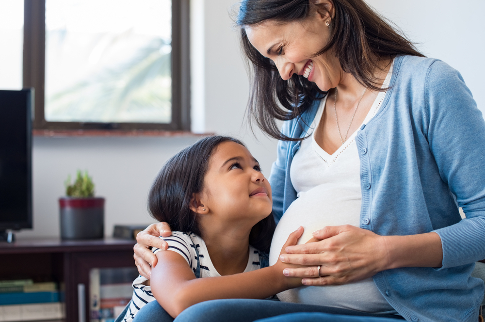A woman experiencing rapid belly expansion during her second pregnancy A woman experiencing rapid belly expansion during her second pregnancy