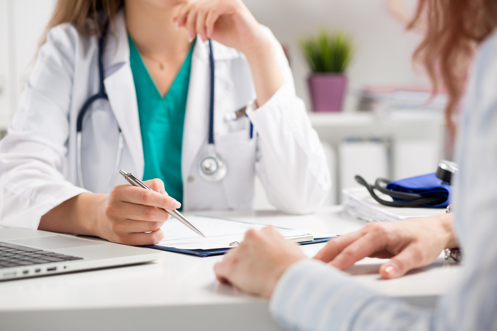Doctor consulting a patient Doctor consulting a patient