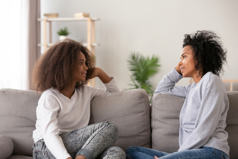 A mother and daughter having a conversation about birth control A mother and daughter having a conversation about birth control