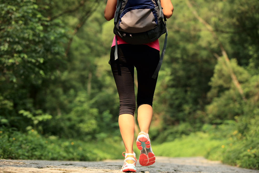 A woman walking to lose weight A woman walking to lose weight