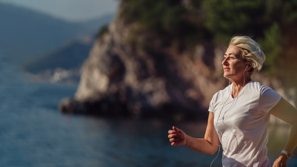 A woman is exercising to lose weight after menopause A woman is exercising to lose weight after menopause