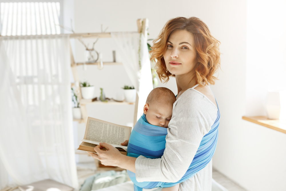 A mother reading to her baby A mother reading to her baby