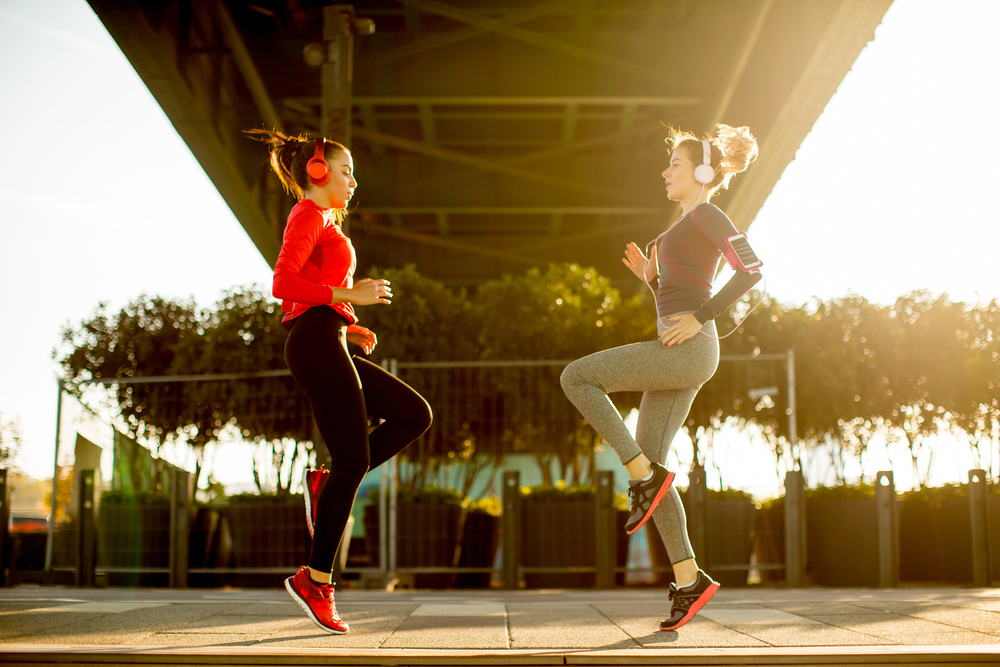 Two friends doing cardio together Two friends doing cardio together