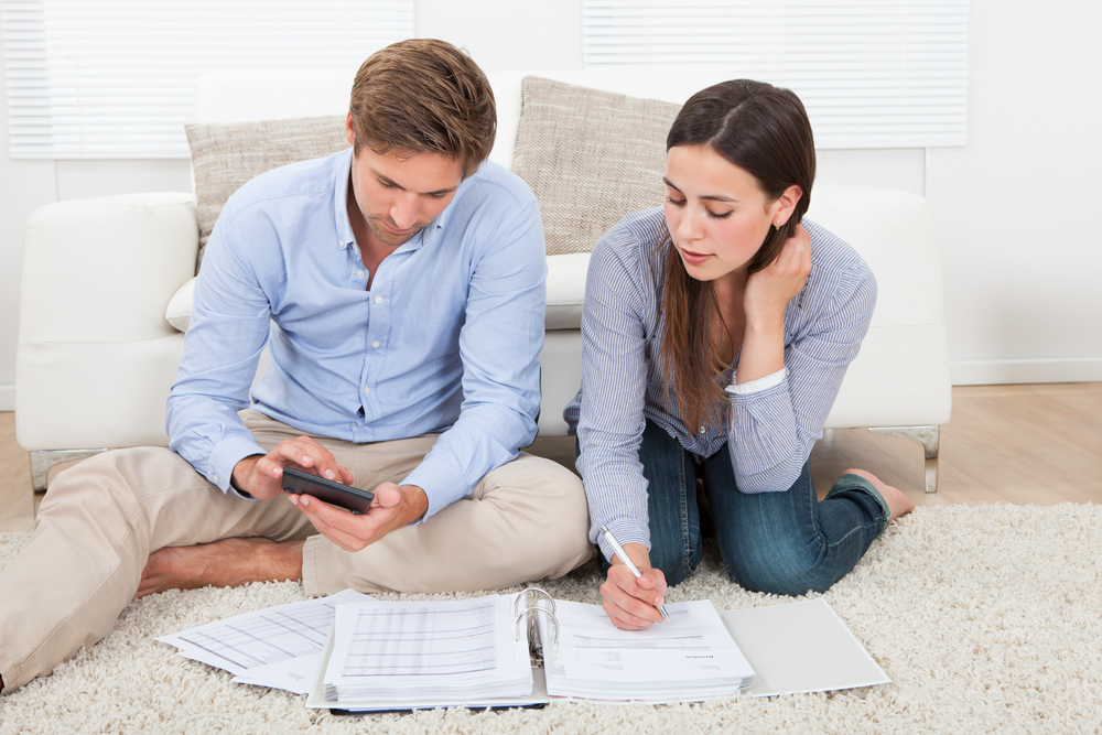 A couple planning their budget A couple planning their budget