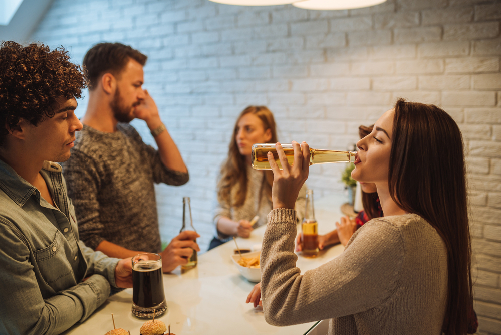 A woman drinking low-carb beer A woman drinking low-carb beer