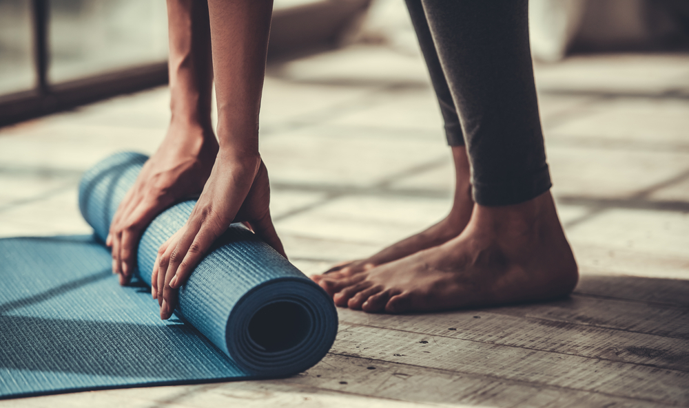 A woman practising yoga during period A woman practising yoga during period