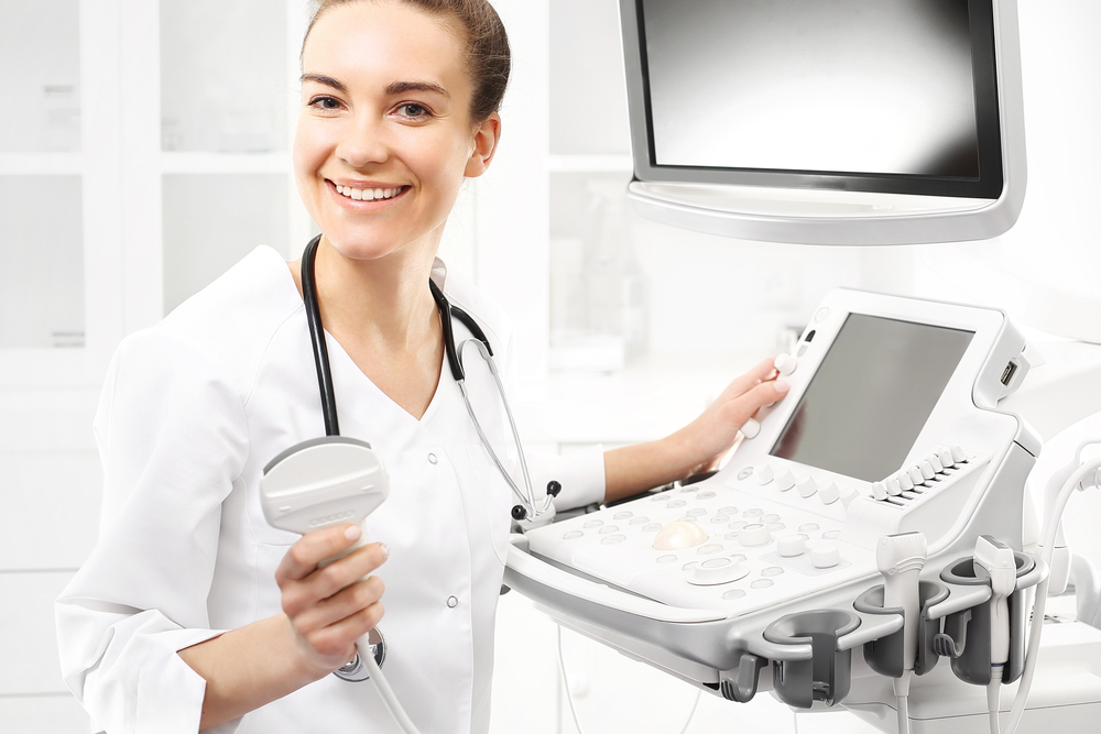a doctor with an ultrasound machine a doctor with an ultrasound machine