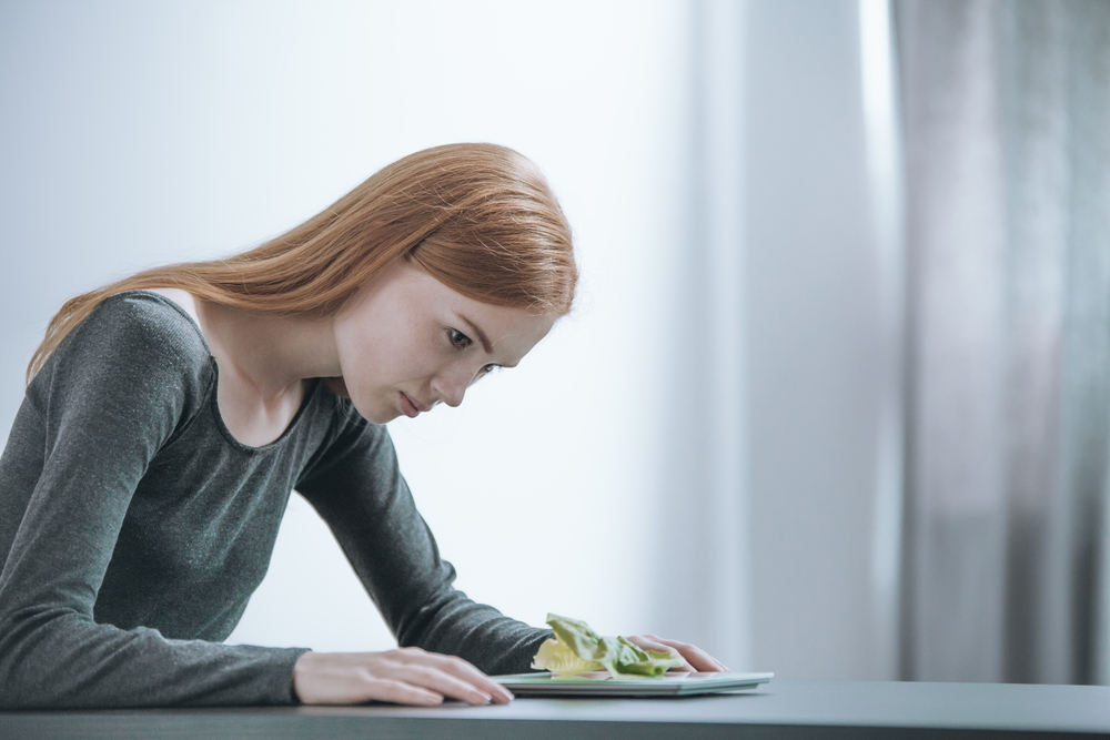 A woman suffering from an eating disorder A woman suffering from an eating disorder
