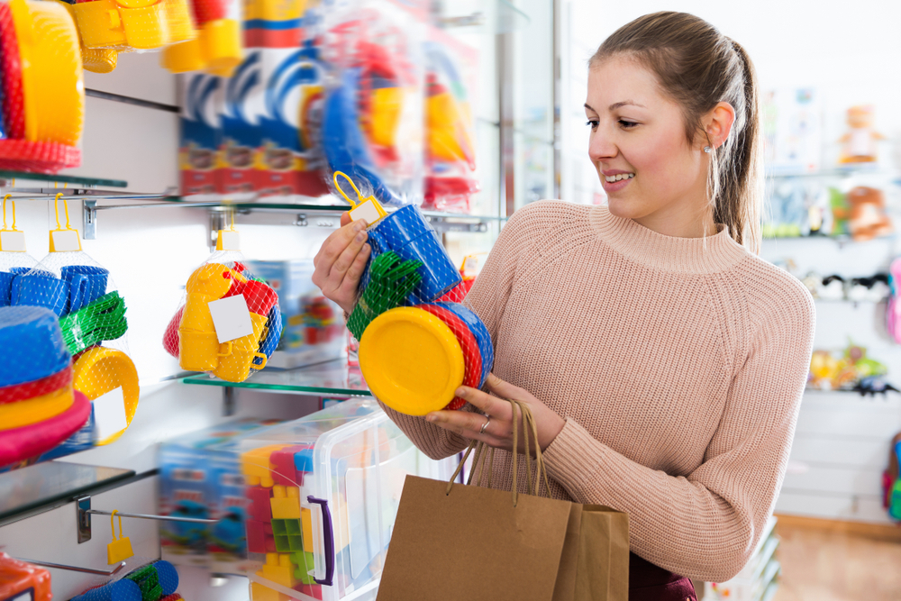A woman choosing the best toys for her 10-month-old baby A woman choosing the best toys for her 10-month-old baby