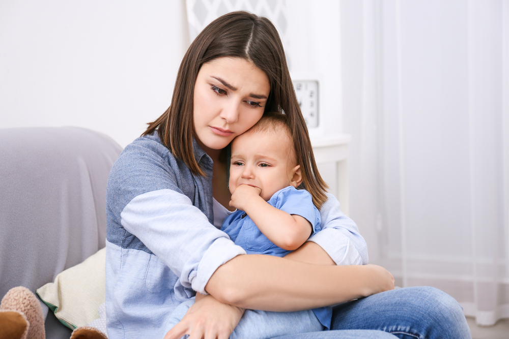 A woman dealing with her baby's separation anxiety A woman dealing with her baby's separation anxiety