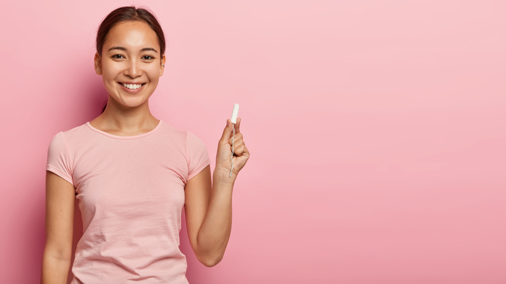 A woman holding a reusable content A woman holding a reusable content