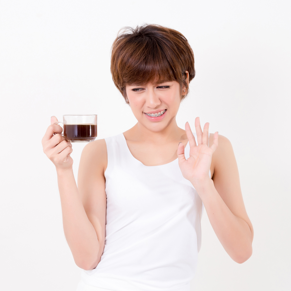 6 weeks pregnant woman with a cup of hot coffee 6 weeks pregnant woman with a cup of hot coffee