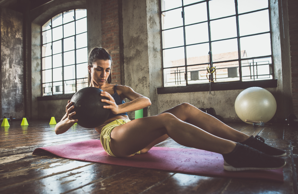A woman doing strength training exercises to get a fast metabolism A woman doing strength training exercises to get a fast metabolism