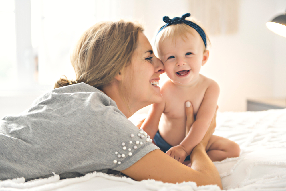 A woman hugging her child A woman hugging her child
