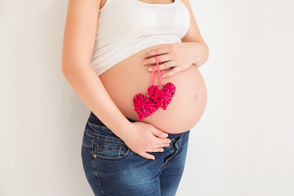 A woman pregnant with twins A woman pregnant with twins