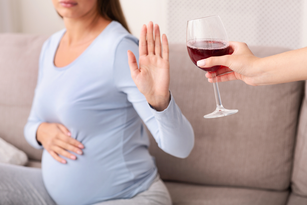 A woman refuses to drink alcohol during pregnancy A woman refuses to drink alcohol during pregnancy