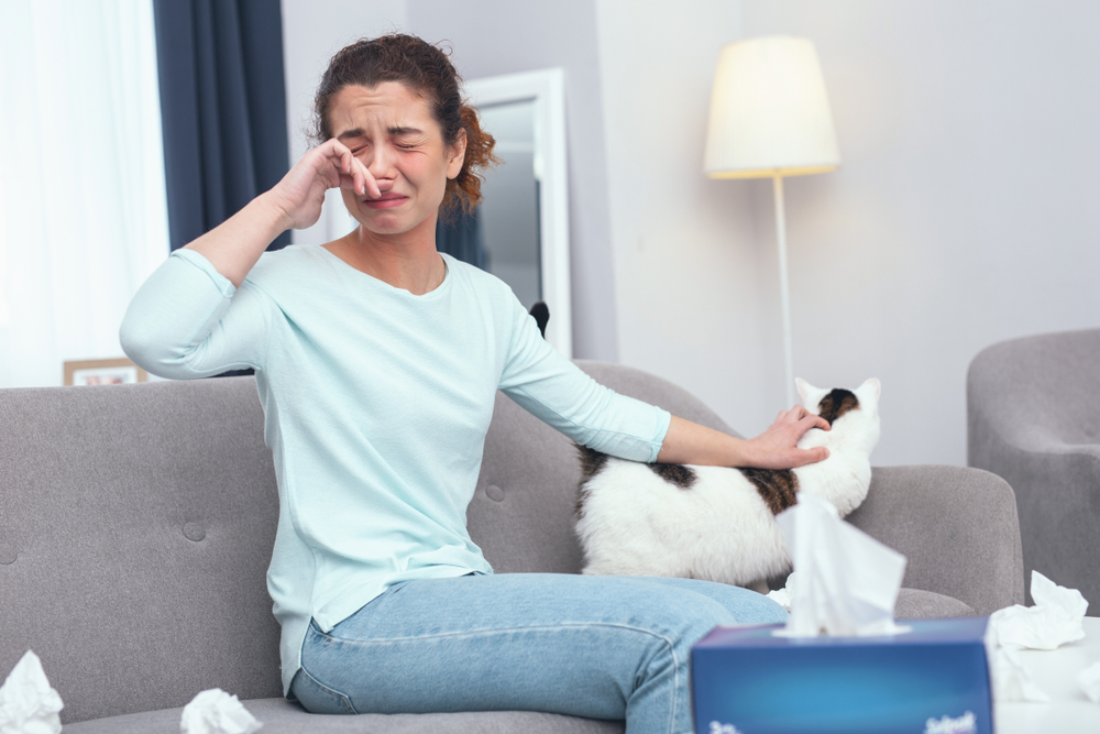 A woman having a runny nose A woman having a runny nose