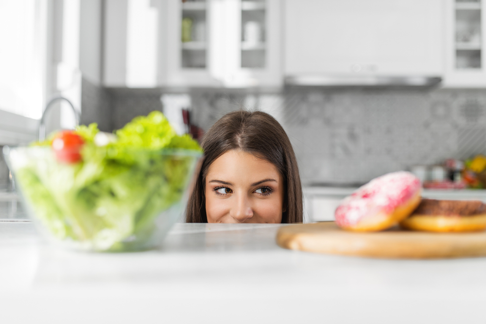 A woman experiencing food cravings 5 DPO A woman experiencing food cravings 5 DPO