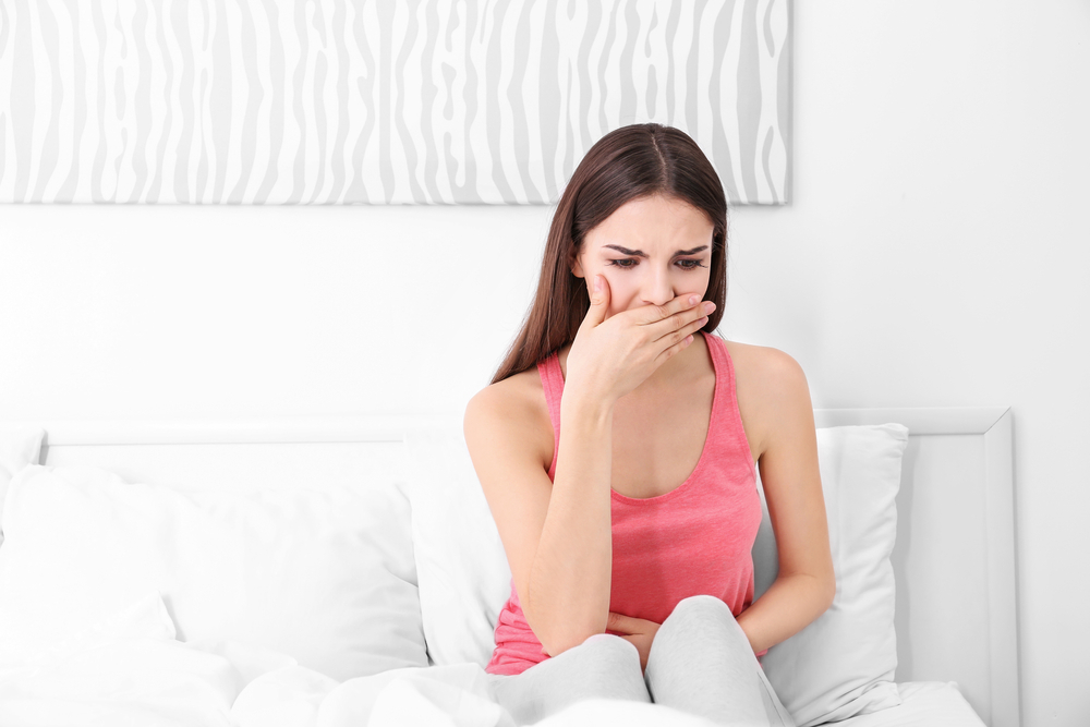 A woman feeling nauseous around 3 DPO A woman feeling nauseous around 3 DPO