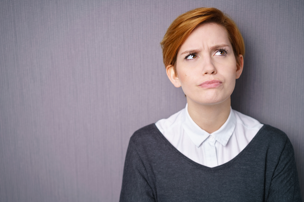woman experiencing PMS mood swings woman experiencing PMS mood swings