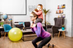 woman lifting up with a baby