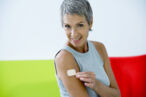 A woman uses a hormone patch for menopause symptoms