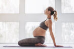 A woman practices yoga to cope with vaginal pain during pregnancy