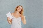 A woman experiencing a hot flash - one of the symptoms of a second puberty in her 40s