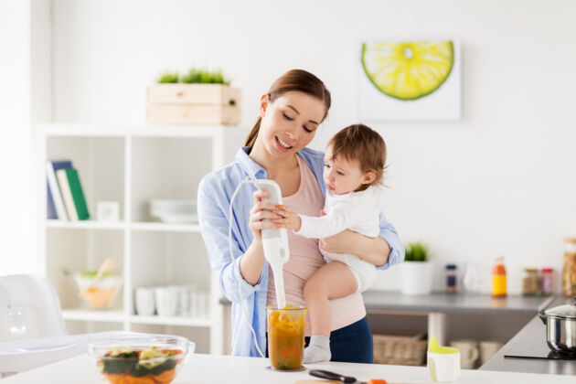 A mother preparing food for her 11-month-old-baby A mother preparing food for her 11-month-old-baby