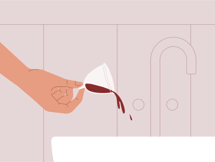 Menstrual cup filled with brown period blood