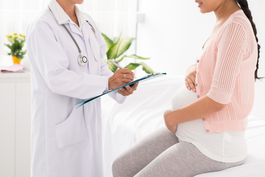 A doctor explains to a woman if she can have a period while she's pregnant A doctor explains to a woman if she can have a period while she's pregnant
